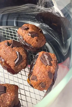 Air fried brownie batter stuffed dates with pools of melted chocolate