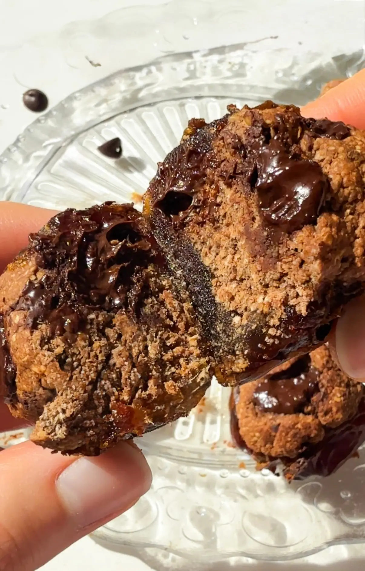 Brownie batter stuffed dates with melty dark chocolate on a plate
