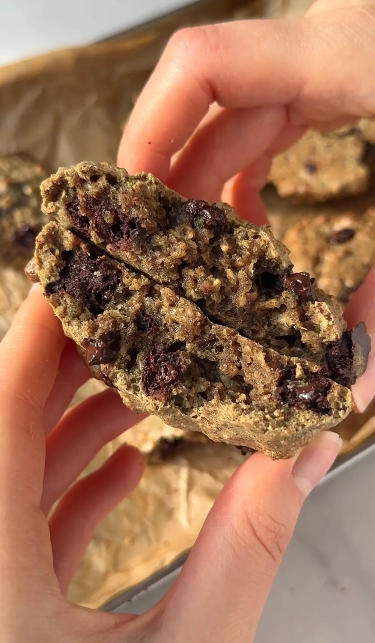 Soft pepita and pecan cookies with chocolate chips on a baking tray